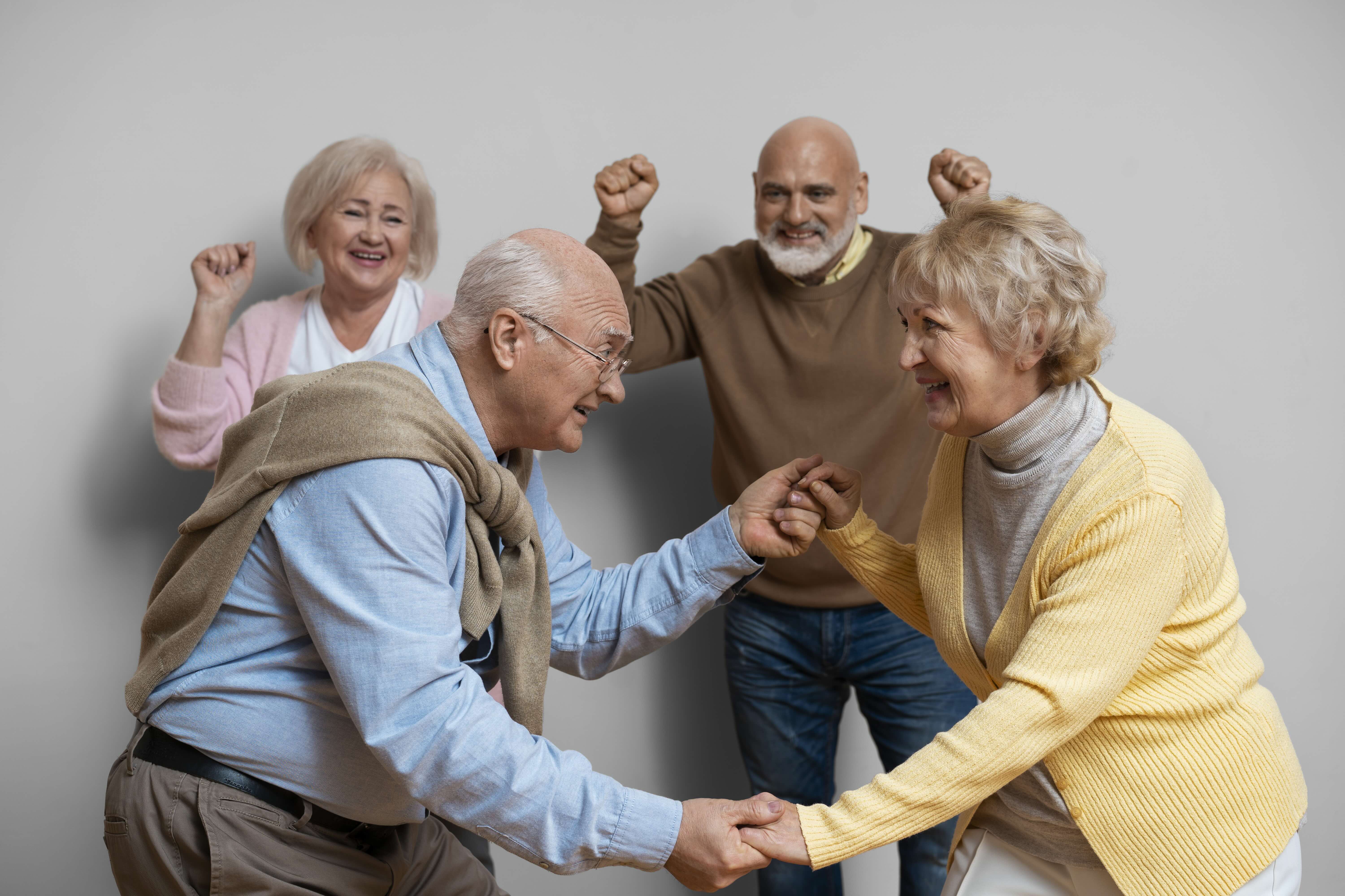 elder-friends-dancing-together-medium-shot